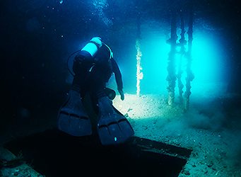 Commercial diver inside the ex HMAS Hobart